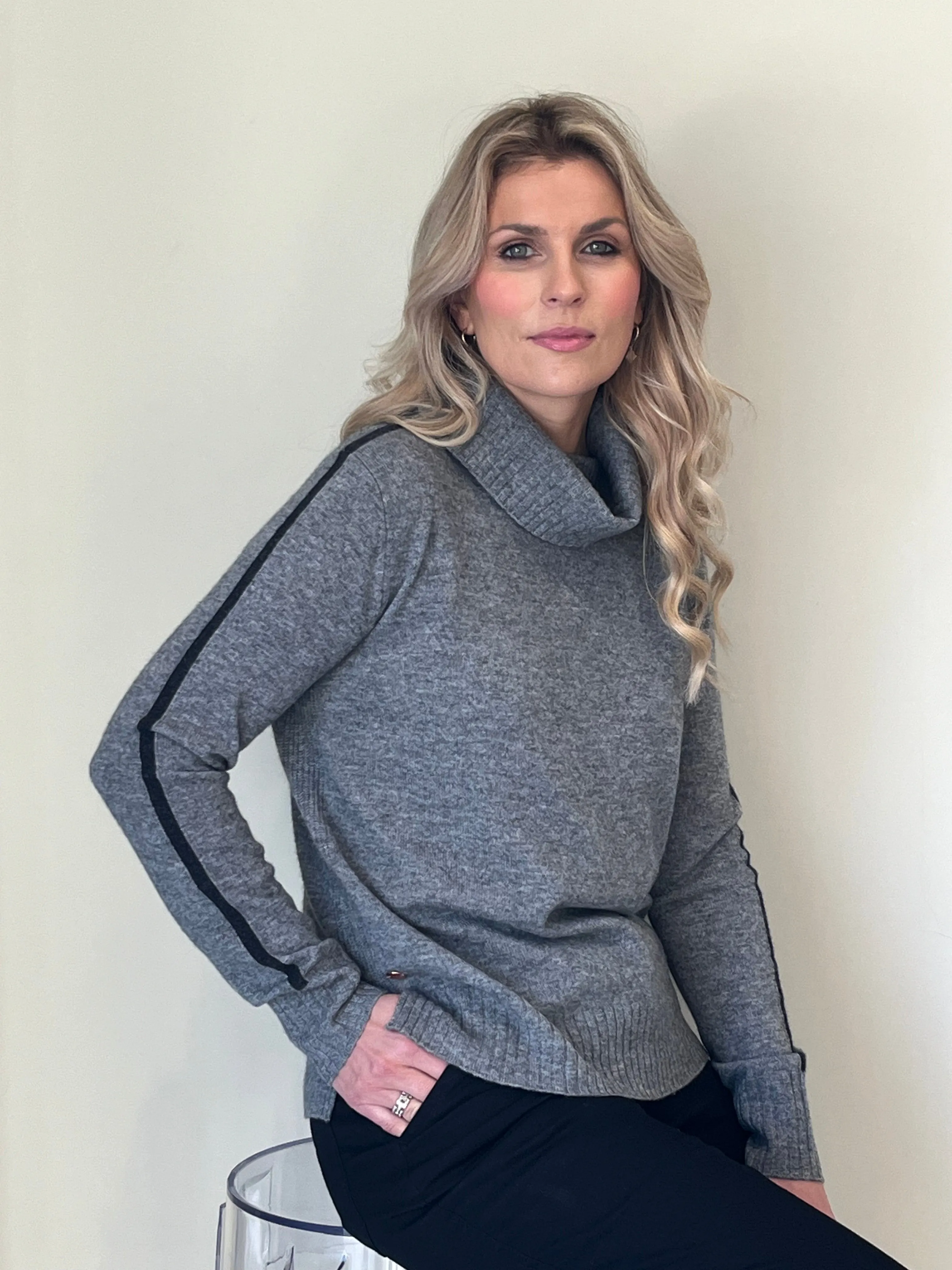 Grey rib detail roll neck with black stripe intarsia detail