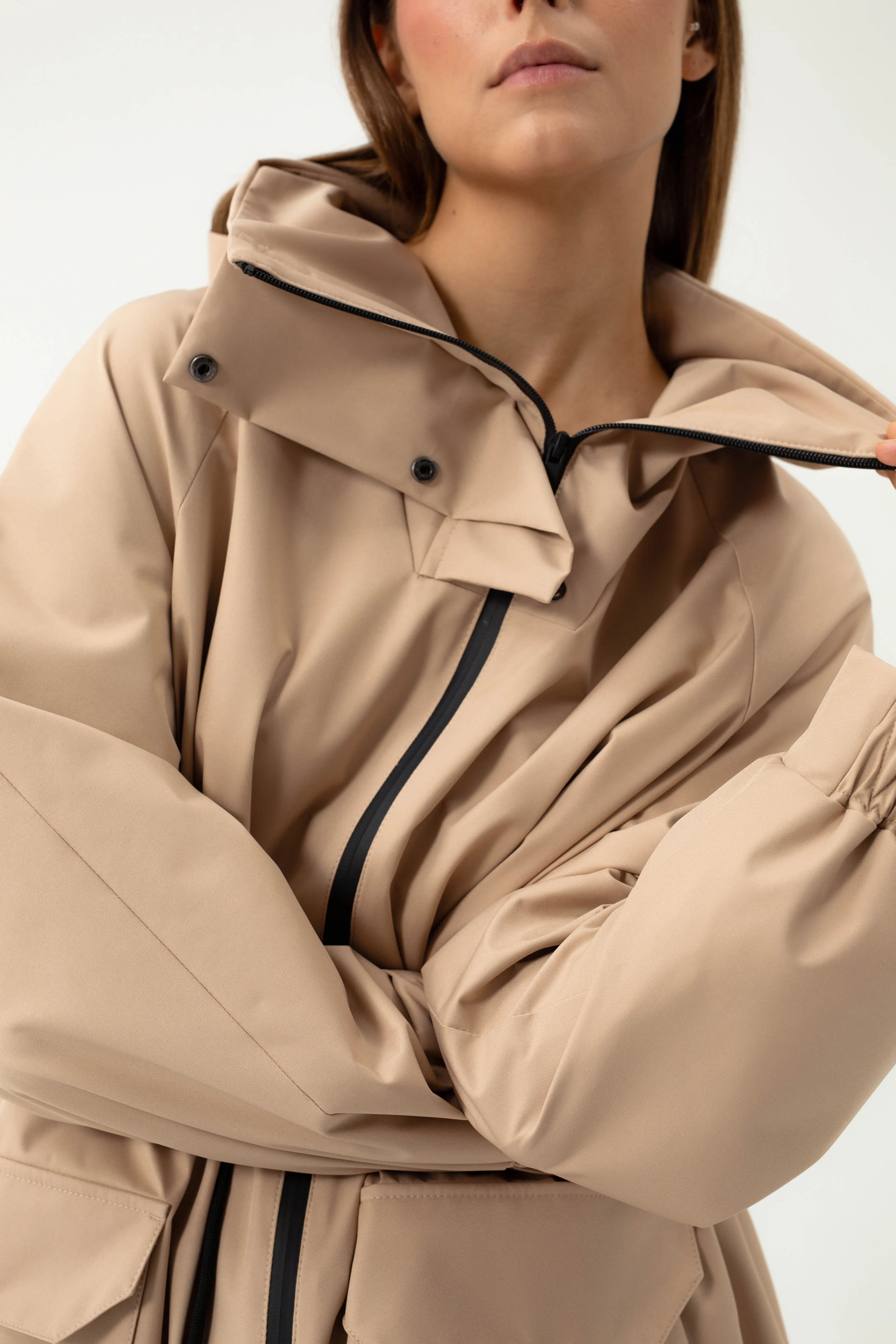 SAND COLORED RAINCOAT WITH HIDDEN HOOD